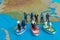 Miniature people concept of Middle Eastern people arrive by boat