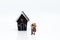 Miniature people : Couple hugged area front of house. Image use for Valentine`s day , planning life after marriage concept