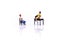 Miniature people : couple of love talking and sitting with chair