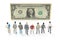 Miniature people. different businessman stands near dollar money. investments and earnings for work