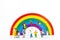Miniature people: family and children enjoy with colorful balloons on rainbow,