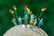 miniature people figure happy family holding balloons standing o