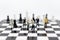 Miniature people, Group Businessmen standing on the chess game, thinking solution for the business game, use as a business