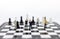 Miniature people, Group Businessmen standing on the chess game, thinking solution for the business game, use as a business