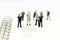 Miniature people, Group of businessmen work with team,