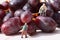 Miniature people picking red grapes C