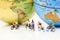 Miniature people : riding bicycle with world map,Sport, Travel a