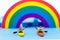 Miniature people : Tourist ride Kayaking along the rainbow. Image use for travel concept