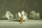 Miniature people toy figure photography. Tired sweeper standing in front of crumple ball of paper on the floor