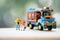 Miniature people : Traveler with backpack standing next to Thai farming trucks. Hitchhiking concept