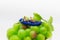 Miniature people : Travelers with paddle boat on the grape. Image use for activities, travel business concept
