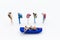 Miniature people : Travelers with paddle boat with group travelers for background. Image use for activities, travel business conce