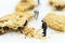 Miniature people : Workers was crushed cookies. Image use for bakery business concept