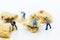 Miniature people : Workers was crushed cookies. Image use for bakery business concept