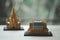 Miniature plastic block of Thai chapel on wood table. Concept of travel Thailand