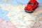 Miniature red car driving on a map of Quebec Canadada