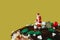 Miniature santa claus on a yule log cake