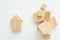 Miniature small house made wooden blocks background of a stack of cubes for assembly.