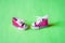 Miniature sneakers isolated on color background