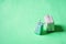 Miniature suitcases isolated on color background