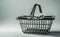 Miniature supermarket basket. Shopping, sale concept. Creative minimalist layout