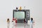 Miniature television and miniature people.