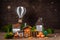 Miniature Thanksgiving little autumn cottages village with air balloon background