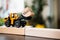 Miniature tracktor lift up Monday wooden block using as business