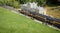 Miniature train in rural landscape