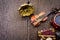 Miniature violin, clocks,travel bag and gramophone on wooden floor.text space on left