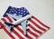 Miniature white airplane on usa flag. Creative concept of air transportation, tourism, travel