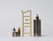 Miniature wood broken ladder and miniature people sitting on the pile of coins.