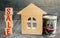 Miniature wooden house and the inscription ` Sale `. real estate concept. sell of a home, apartment property sell. Affordable hous