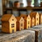 Miniature wooden houses on a wooden background. Real estate concept.