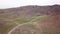 The minibus goes on the green steppe. Top view.