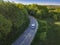 Minibus or minicoach on rural landscape road aerial