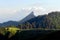 Minibus in mountains, outdoor recreation. Sharp peak, fir-trees and rocks in Charmant Som, France