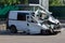 A minibus wrecked after an accident in a parking lot
