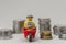 Minifigures of bank robbers stealing money.Thieves carrying coins