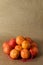 Minimal composition - A net of clementines on brown paper