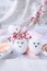 Minimal easter concept. Easter eggs with painted smiley faces and bird feather on pastel background. Wedding couple eggs. Married