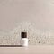 minimal empty terrazzo counter table top on beige brown stucco cement wall