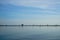 Minimal fisherman hut, bamboo and wooden stick structure fishery farm above sea wetland with clear sky background