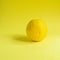 Minimal food concept. Lemon on a bright yellow background. Free space for text. Top view. Minimalism. Creative citrus fruits