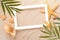 Minimal Frame summer background, Sand shells Seastar with blurred Palm,