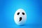 minimal and funny Halloween holiday concept. white egg with scary cute face.