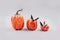 Minimal Halloween scary and concept. Decorative orange pumpkins with bats on light gray background with copy space