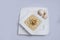 Minimal Hero Shot of a Mushroom Soup with bread crumbs, oregano on a minimal white background with a 60 degree front facing