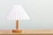 Minimal lamp on wood table.concept copy space