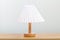 Minimal lamp on wood table.concept copy space